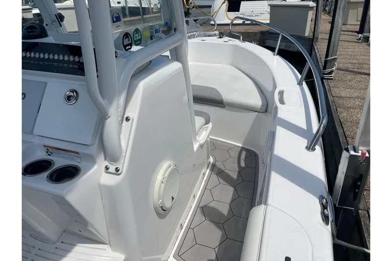 Slide: The Image of 2018 Everglades 230 Center Console boat interior with seating and control panel. - 17