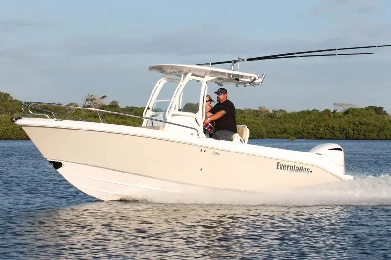 Slide: The Image of Manufacturer Provided Image: 2018 Everglades 230 Center Console boat cruising on water. - 22