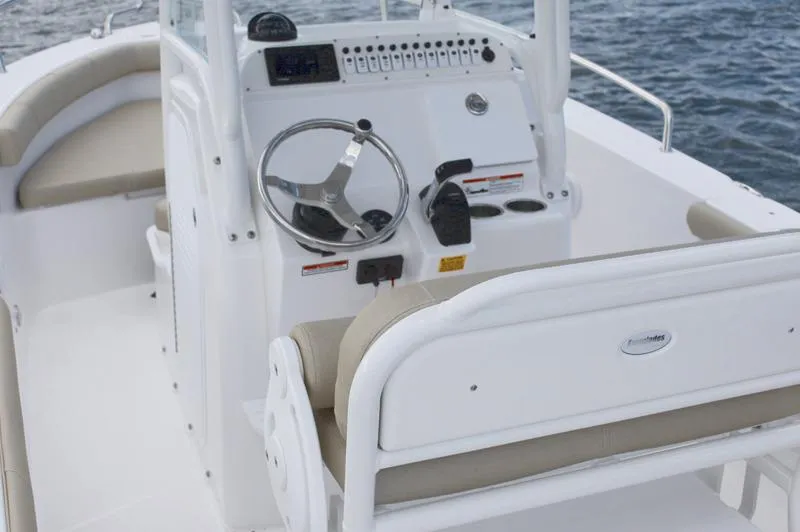 Slide: The Image of Manufacturer Provided Image: 2018 Everglades 230 Center Console boat interior with steering wheel and seating. - 28