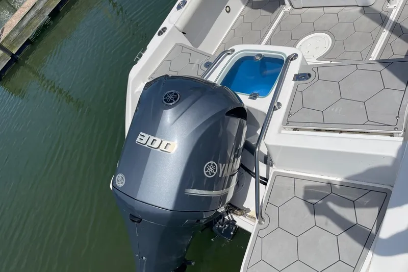 Slide: The Image of 2018 Everglades 230 Center Console boat with Yamaha 300 outboard motor on water. - 3