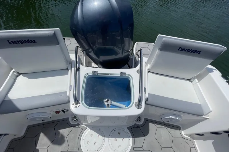 Slide: The Image of 2018 Everglades 230 Center Console boat interior with seating and engine view. - 5