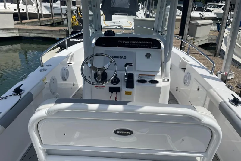Slide: The Image of 2018 Everglades 230 Center Console boat interior with steering wheel and controls. - 6