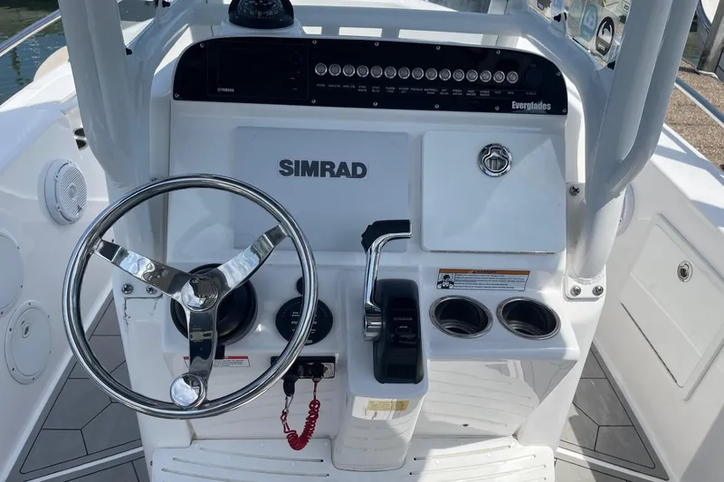 Slide: The Image of Center console of 2018 Everglades 230 boat with steering wheel and controls. - 7
