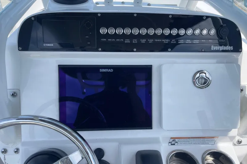 Slide: The Image of Control panel of a 2018 Everglades 230 Center Console boat with Simrad display. - 8
