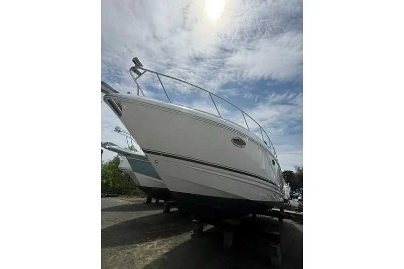 The Image of 2002 Chaparral 350 Signature boat under a cloudy sky, viewed from below. - 0