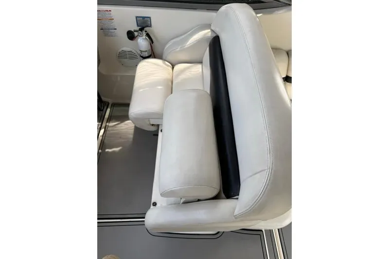Slide: The Image of White leather seating on a 2002 Chaparral 350 Signature boat interior. - 11