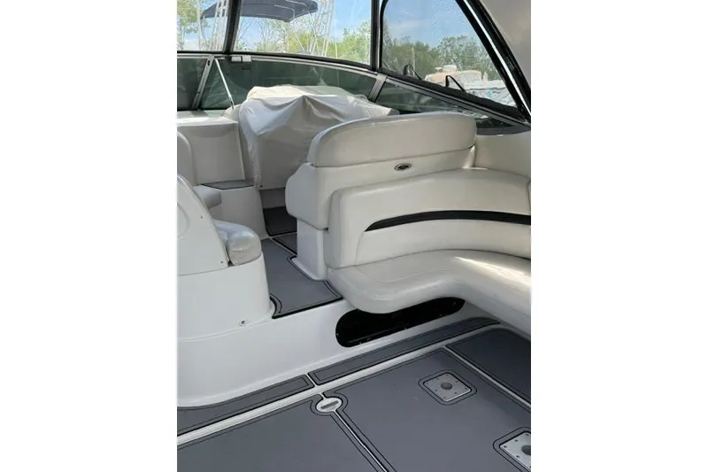 Slide: The Image of 2002 Chaparral 350 Signature boat interior with white seating and sleek design. - 13