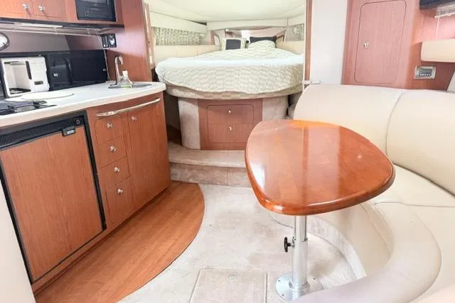 Slide: The Image of Interior of 2002 Chaparral 350 Signature yacht with cozy seating and modern amenities. - 15