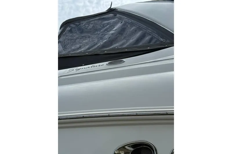 Slide: The Image of 2002 Chaparral 350 Signature boat with sleek design and clear canopy. - 2