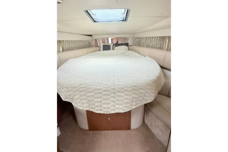Slide: The Image of Interior cabin of 2002 Chaparral 350 Signature with a cozy bed setup. - 24