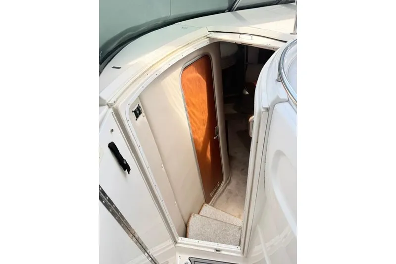 Slide: The Image of 2002 Chaparral 350 Signature cabin entrance with wooden door and steps. - 26