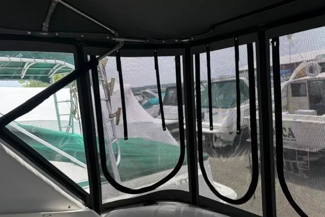 Slide: The Image of Interior view of a 2002 Chaparral 350 Signature boat with mesh windows. - 6