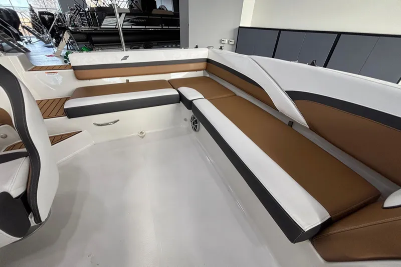 Slide: The Image of Interior of 2025 Starcraft SVX 191 OB with brown and white seating. - 12