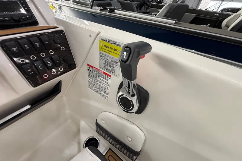 Slide: The Image of 2025 Starcraft SVX 191 OB control panel with throttle and steering lever. - 6