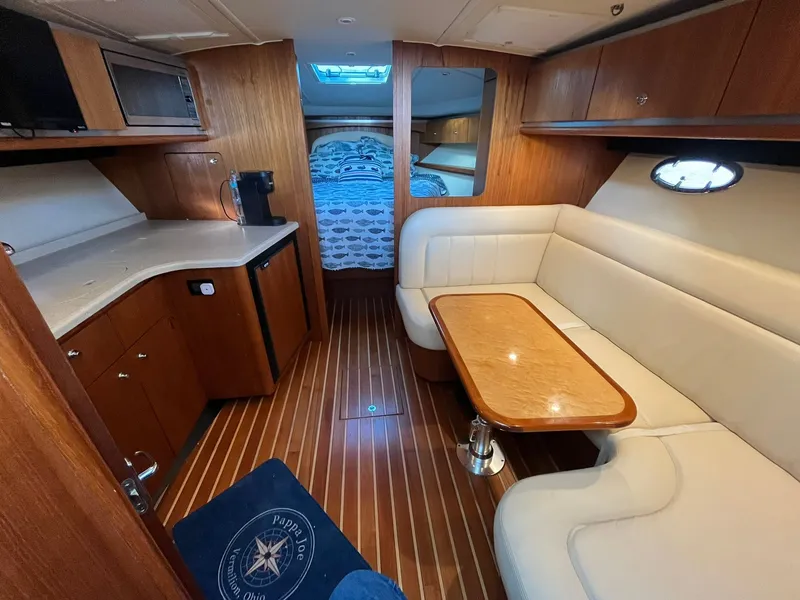 Slide: The Image of Interior of a 2006 Tiara Yachts 3600 Open with kitchen and seating area. - 41