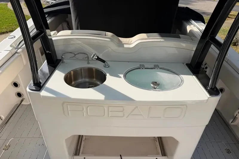 Slide: The Image of 2017 Robalo R302 Center Console with sink and storage. - 14
