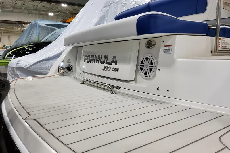 Slide: The Image of 2027 Formula 330 Crossover Bowrider OB, featuring sleek deck design and modern seating. - 10