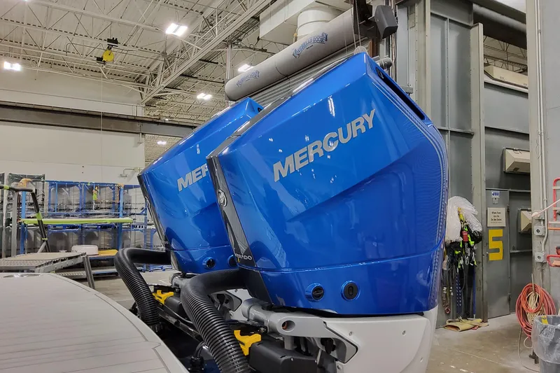 Slide: The Image of Twin blue Mercury outboard engines on a 2027 Formula 330 Crossover Bowrider OB boat. - 12