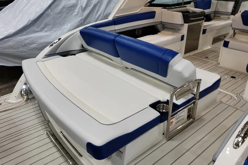 Slide: The Image of 2027 Formula 330 Crossover Bowrider OB interior with blue and white seating, sleek design. - 20