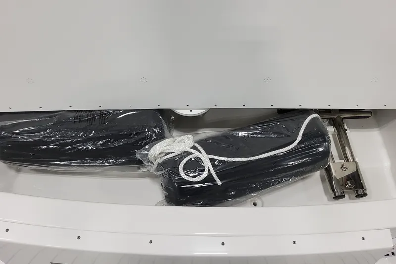 Slide: The Image of Storage compartment of 2027 Formula 330 Crossover Bowrider OB with packaged boat accessories. - 23