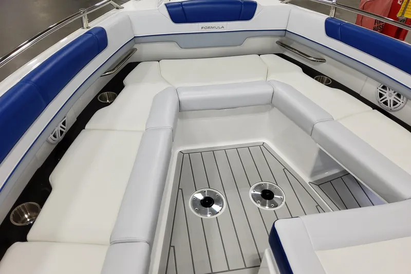 Slide: The Image of 2027 Formula 330 Crossover Bowrider OB interior with blue and white seating, sleek design. - 25