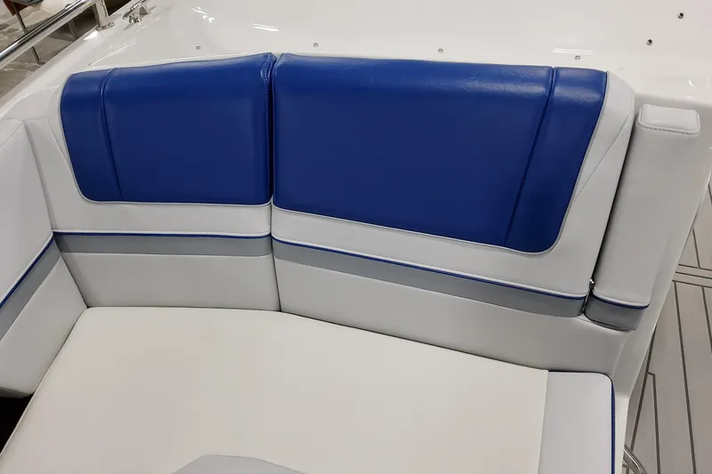 Slide: The Image of 2027 Formula 330 Crossover Bowrider OB boat seating with blue and white upholstery. - 28