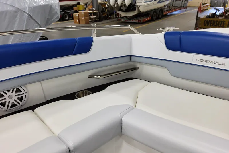 Slide: The Image of 2027 Formula 330 Crossover Bowrider OB interior with blue and white seating. - 33