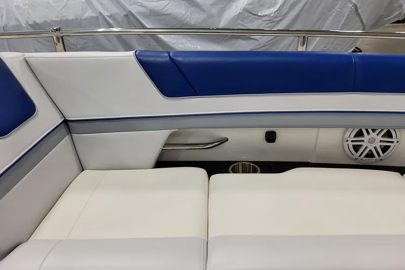 Slide: The Image of 2027 Formula 330 Crossover Bowrider OB interior with blue and white seating, speaker, and railing. - 35