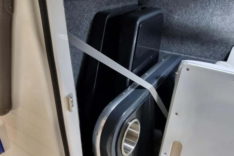 Slide: The Image of Storage compartment in 2027 Formula 330 Crossover Bowrider OB boat, featuring secured panels. - 41