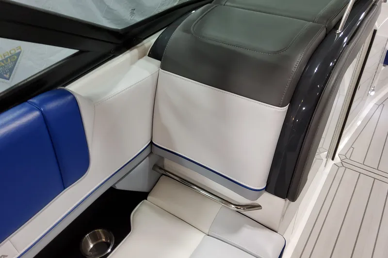 Slide: The Image of Luxurious seating on 2027 Formula 330 Crossover Bowrider OB with blue and gray accents. - 44