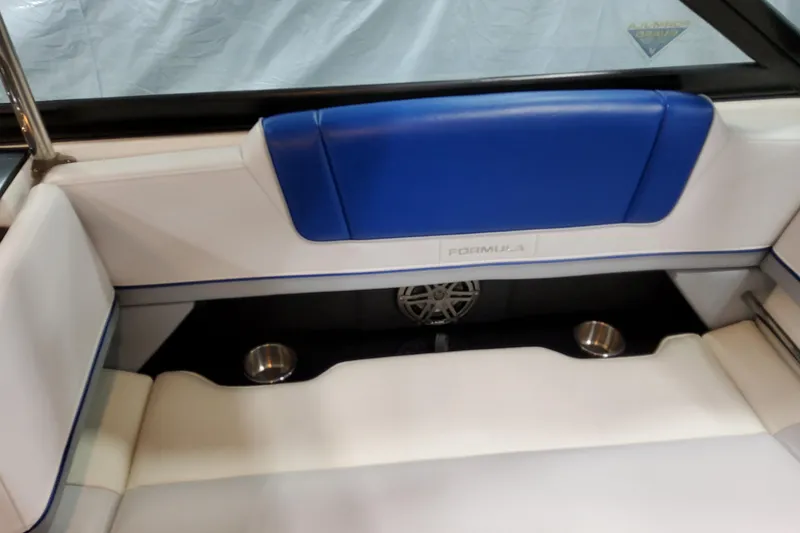 Slide: The Image of 2027 Formula 330 Crossover Bowrider OB interior with blue and white seating, cup holders. - 45