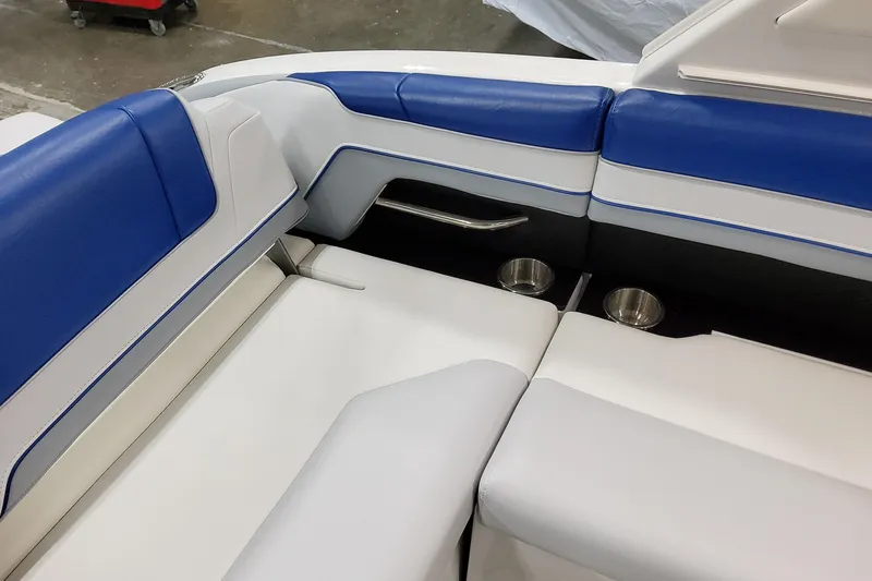 Slide: The Image of Luxurious seating on 2027 Formula 330 Crossover Bowrider OB with blue and white upholstery. - 52