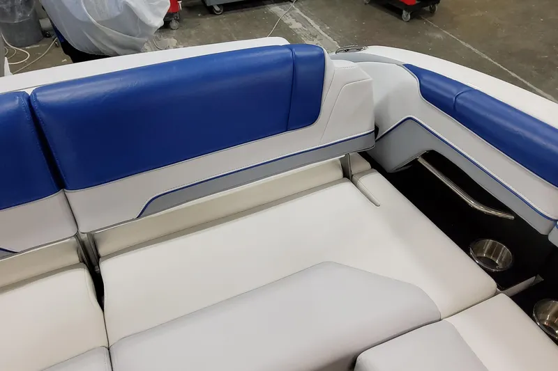 Slide: The Image of 2027 Formula 330 Crossover Bowrider OB interior with blue and white seating. - 53