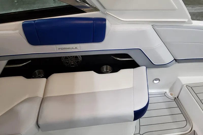 Slide: The Image of 2027 Formula 330 Crossover Bowrider OB interior with blue and white seating. - 57