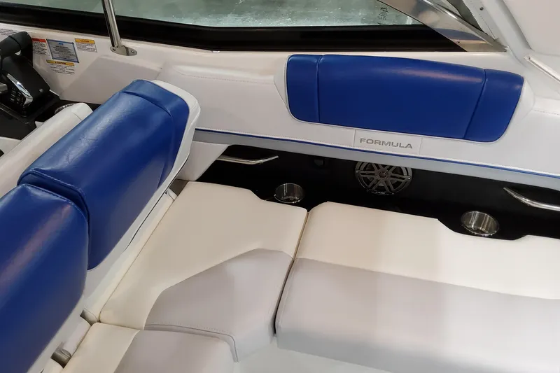 Slide: The Image of Interior of 2027 Formula 330 Crossover Bowrider OB with blue and white seating. - 58