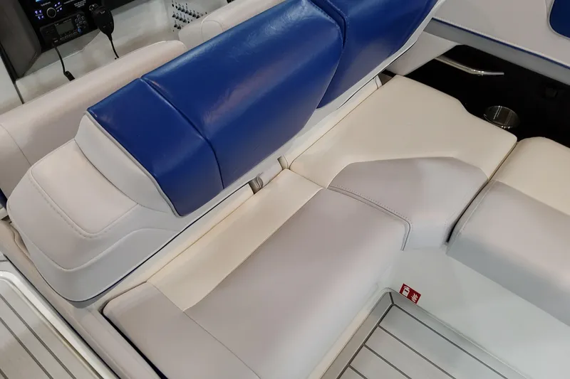 Slide: The Image of Luxurious seating on 2027 Formula 330 Crossover Bowrider OB, featuring blue and white upholstery. - 59