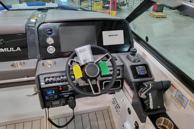 Slide: The Image of 2027 Formula 330 Crossover Bowrider OB dashboard with steering wheel and controls. - 65