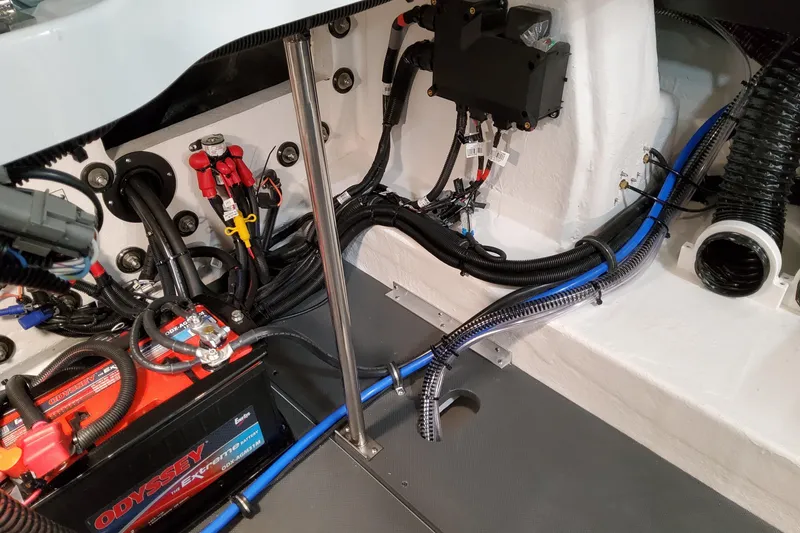 Slide: The Image of Engine compartment of 2027 Formula 330 Crossover Bowrider OB with wiring and battery setup. - 75