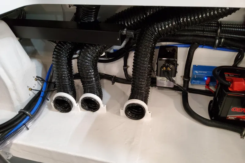 Slide: The Image of Engine compartment of 2027 Formula 330 Crossover Bowrider OB with wiring and ventilation ducts. - 76