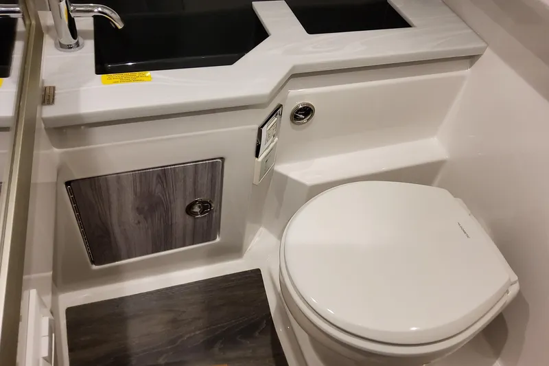 Slide: The Image of 2027 Formula 330 Crossover Bowrider OB bathroom with modern sink and toilet design. - 87