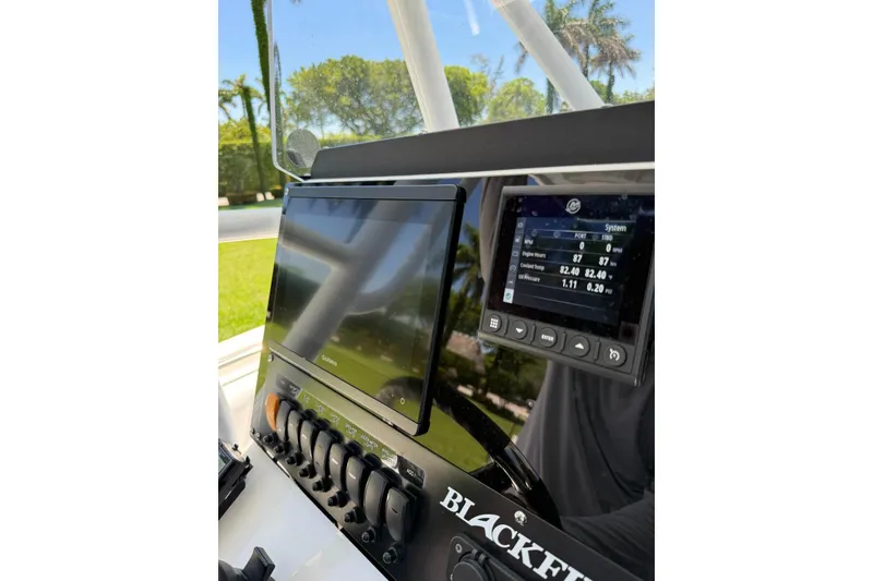 Slide: The Image of Dashboard of 2022 Blackfin 252 CC boat with navigation and control systems. - 11