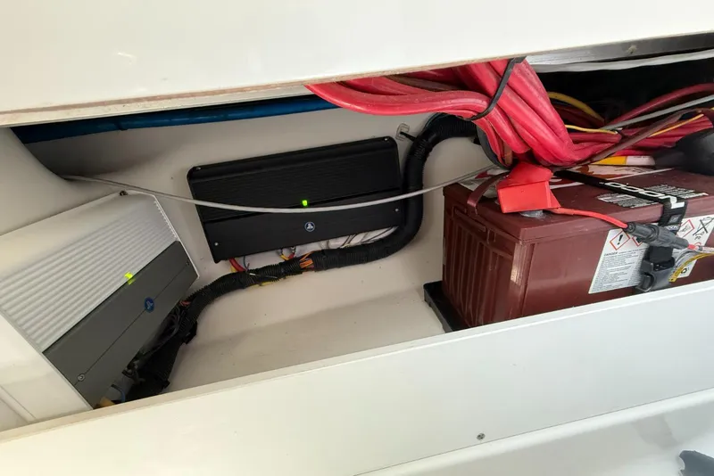 Slide: The Image of 2022 Blackfin 252 CC boat electrical system with battery and wiring components. - 31