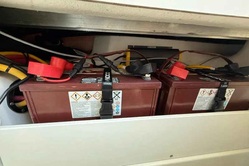 Slide: The Image of Batteries installed in a 2022 Blackfin 252 CC boat compartment. - 32