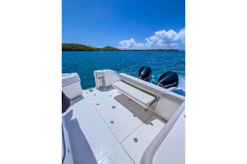 Slide: The Image of 2024 Boston Whaler 325 Conquest boat on blue ocean with clear sky. - 3