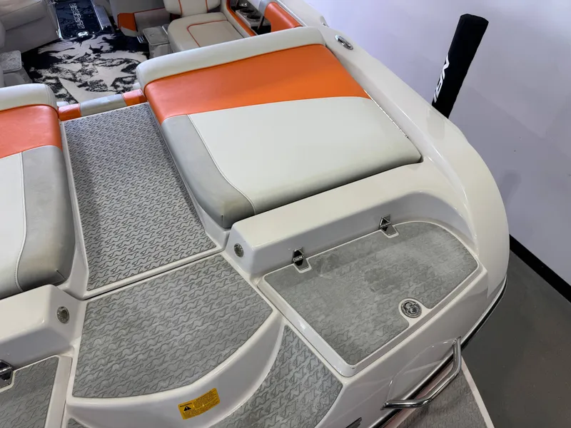Slide: The Image of 2008 Nautique Super Air Nautique 230 boat rear with orange and white seating. - 11