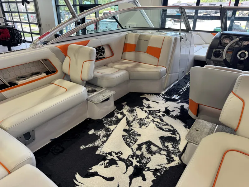 Slide: The Image of Interior of a 2008 Nautique Super Air Nautique 230 boat with stylish seating. - 14