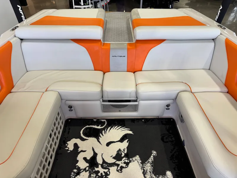 Slide: The Image of Interior of 2008 Nautique Super Air Nautique 230 boat with orange-white seating. - 27