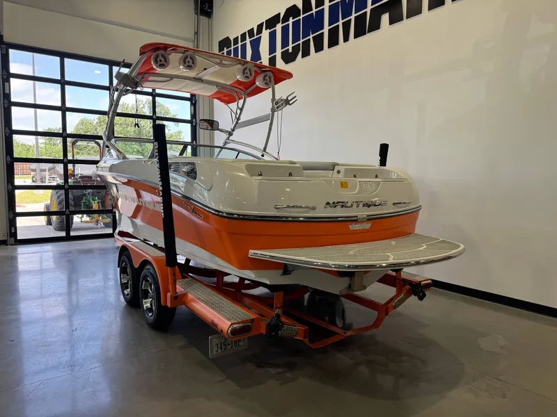Slide: The Image of 2008 Nautique Super Air Nautique 230 boat in a garage. - 5