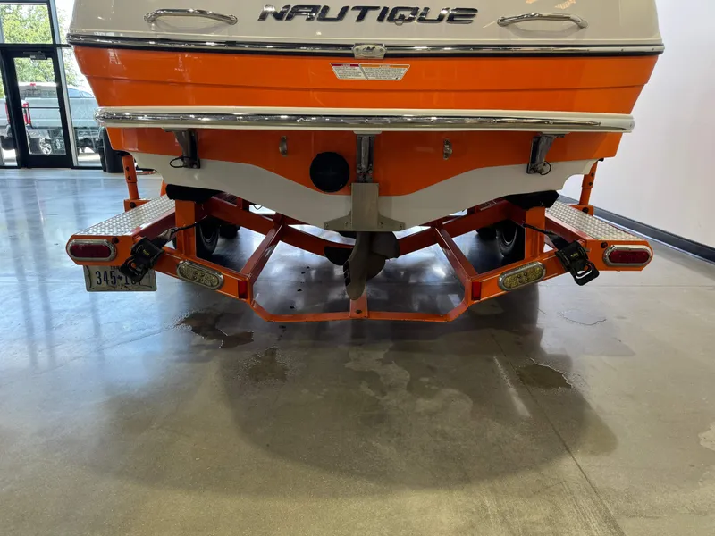 Slide: The Image of Rear view of a 2008 Nautique Super Air Nautique 230 boat on trailer. - 7