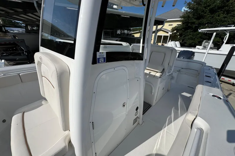 Slide: The Image of 2022 Sea Hunt Ultra 275 SE boat interior with seating and console. - 20